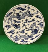 A 19th Century Chinese Daoguang (1821-1850) blue and white porcelain charger decorated with five