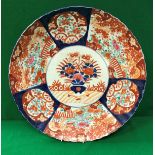 A 19th Century Japanese Imari charger decorated with panels of flowers, within a lobed rim,