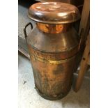 A copper and brass banded milk churn, the lid inscribed "Oakdale Creameries",
