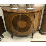 A 19th Century walnut and inlaid demi-lune cabinet in the Sheraton style,