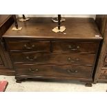A circa 1900 mahogany chest of two short over two long drawers on ogee bracket feet