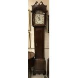 An oak cased long case clock of slim proportions,