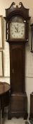 An oak cased long case clock of slim proportions,