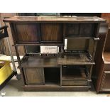 A mid 20th Century Japanese hardwood sideboard of multiple cupboards and shelving