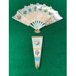 A Victorian printed cardboard fan of arrow form inscribed "The Language of Flowers,