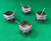 A set of four Chinese silver or white metal and blue enamel decorated salts of square form embossed