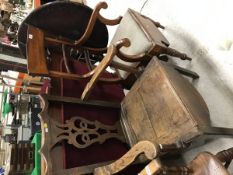 A 19th Century oak commode armchair in the Provincial Chippendale taste and a 19th Century mahogany