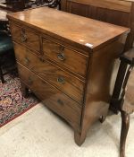 A 19th Century mahogany chest of two short over two long drawers raised on bracket feet