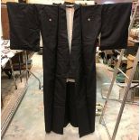 A mid 20th Century silk coat and haori, both in black,