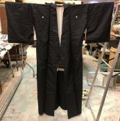 A mid 20th Century silk coat and haori, both in black,