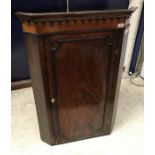 A George III mahogany hanging corner cupboard together with an 18th Century walnut and inlaid slat
