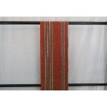 A circa 1960 cotton Kyo Fukuro obi with Shima (stripe) decoration in orange and cream on a red