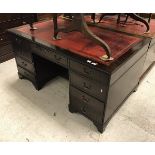 A modern reproduction mahogany kneehole desk