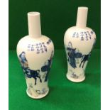 A pair of Chinese blue and white baluster shaped vases with narrow necks,