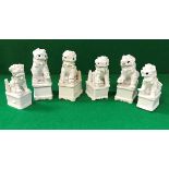 A collection of six 19th Century Chinese blanc-de-chine figures of temple lions,