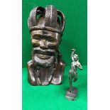 An African carved hardwood figure of a bearded tribal chieftain in leaf decorated crown by Alex