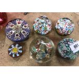 A collection of six various millefiori paperweights,