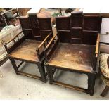 A pair of 19th Century Chinese lacquered elm throne or marriage chairs with carved medallion