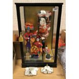 A collection of modern Japanese ornaments and dolls to include an okinawan doll,