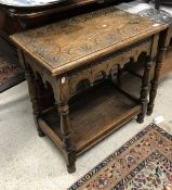 A carved oak side table