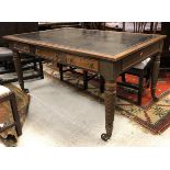A 19th Century mahogany library table with tooled leather writing surface over three frieze drawers