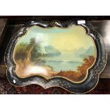 A 19th Century painted Toleware tea tray with figure seated in foreground,