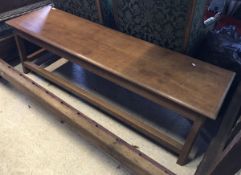 A 20th Century oak low side table/bench,