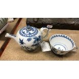A Meissen blue and white miniature teapot with bird and blossom decoration,