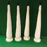 A collection of four plaster of Paris table lamps (believed to be castings of leather and