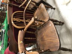 A 19th Century oak stick back Windsor elbow chair together with a 19th Century oak captain's chair