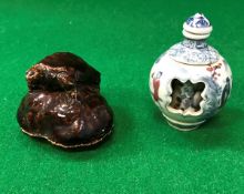 A 19th Century blue and white porcelain scent bottle with pierced outer case and inner flask