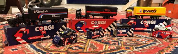 A box containing various Corgi boxed vehicles including Volvo container truck,