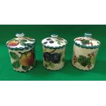Three Wemyss preserve pots with lids, one depicting red currants,