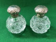 A pair of modern silver hobnail cut grenade form scent bottles with silver mounts in the Victorian
