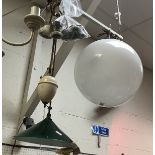 A vintage rise and fall lamp with green glass shade,