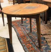 A 19th Century elm cricket table of typical form (legs slightly cut down),