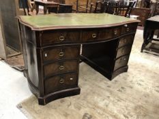 A 19th Century mahogany serpentine fronted kneehole desk,