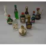 A box of various miniature spirits to include Moscatel Dalmau, Midori Melon liqueur,