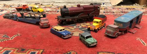 A box of various toys/models including O gauge clockwork train 044,