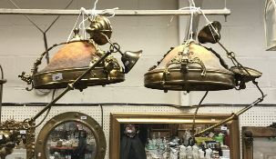 A pair of brass mounted ceiling lights with domed cased glass shade with mottled decoration in the