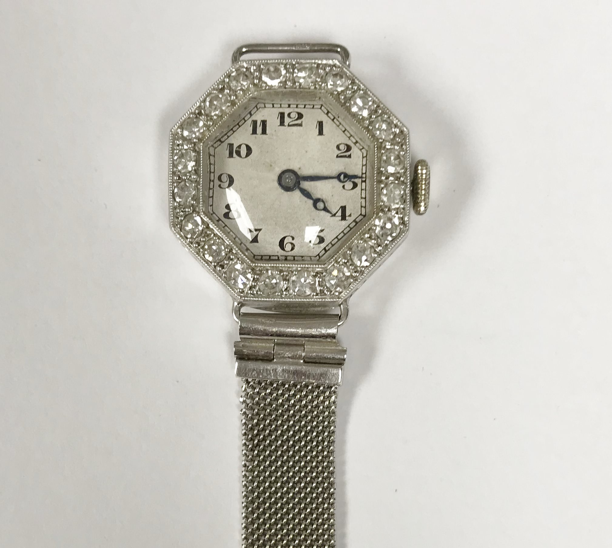 An 18 carat gold and platinum cased diamond encrusted cocktail watch of octagonal form,