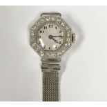 An 18 carat gold and platinum cased diamond encrusted cocktail watch of octagonal form,