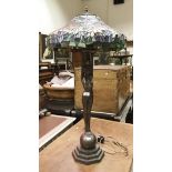 A modern Tiffany style figural table lamp