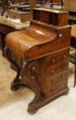 A Victorian burr walnut piano fronted Davenport desk with pop up stationary compartment and