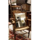 A 19th Century mahogany dressing mirror on turned and reeded supports to platform base,