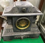 A Victorian black marble cased mantle clock of architctural form,