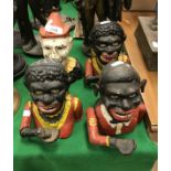 A collection of four various replica cast iron and painted money boxes,