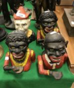 A collection of four various replica cast iron and painted money boxes,