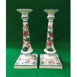 A pair of Wemyss candlesticks with Sweet Pea decoration, the bases stamped "Wemyss ware R.