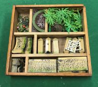 A box containing various Britains accessories including eight sections of drystone walling,